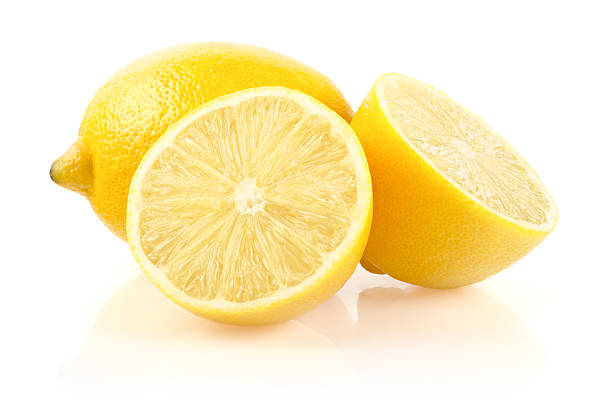 com metade de limão sobre fundo branco - lemon textured peel portion - fotografias e filmes do acervo