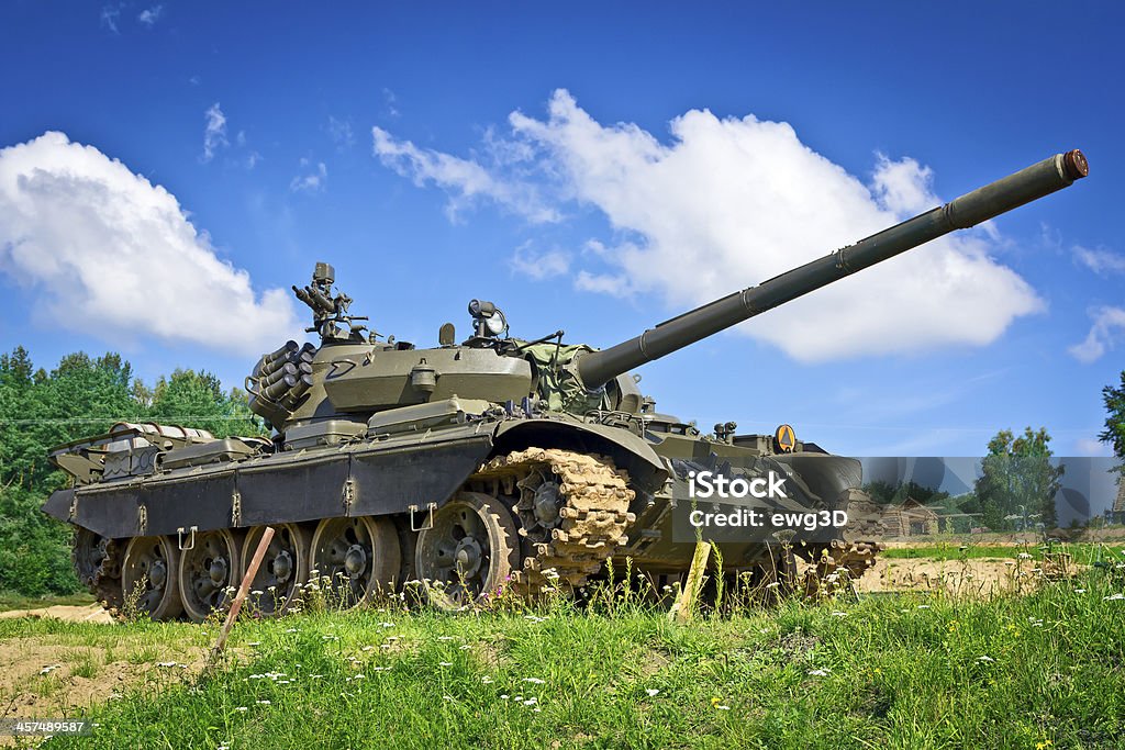 Old Russian tank T-55 Old Russian tank T-55 in the battlefield Aggression Stock Photo