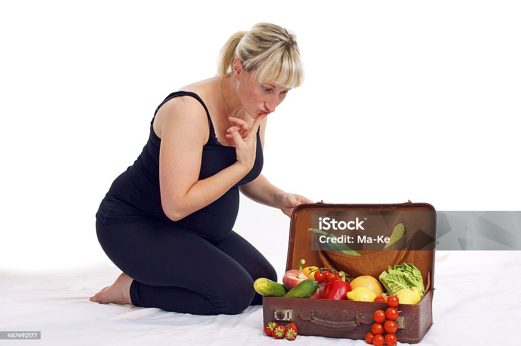 Pregnancy pregnant woman with healthy fruit and vegetables 6-11 Months Stock Photo
