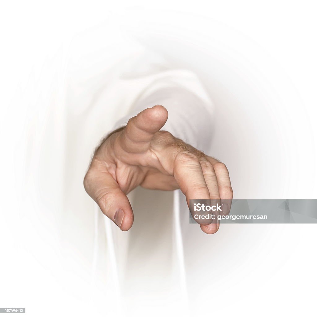 Showing towards you Men's hand in a white robe showing something Ceremonial Robe Stock Photo