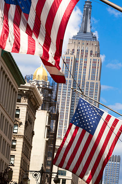 istock Empire State Building and US Flag New York City 457500189