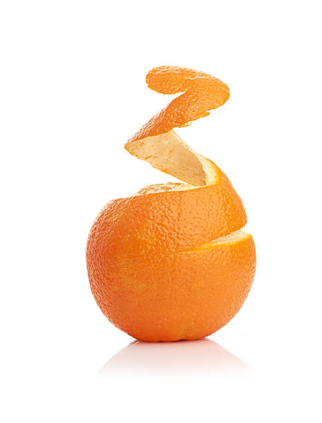 istock orange with peeled spiral skin 457505727
