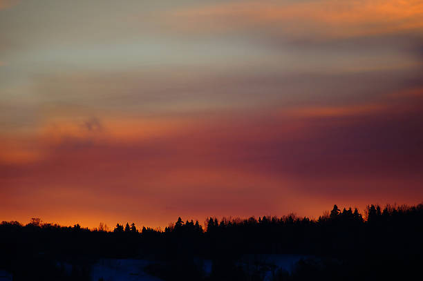 istock Dramatic sunset over Canadian winter forest, Quebec, Canada 457513503