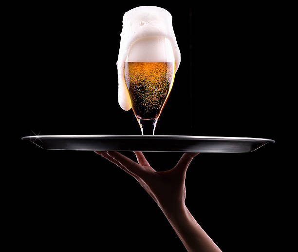 istock Beer into glass on a black 457514305