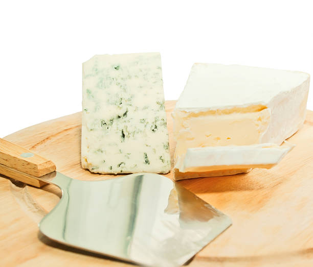 istock Brie and dor blue cheese on wooden desk with knife 457515621