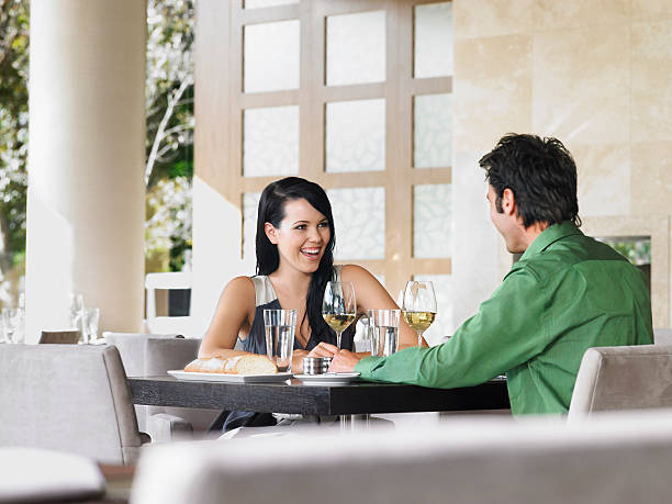 istock Couple Enjoying Wine At Outdoor Restaurant 457517511