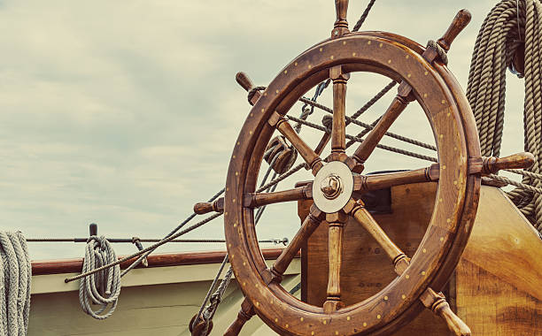 Tall Ship's Helm The helm of a tall ship. vintage steering wheel stock pictures, royalty-free photos & images