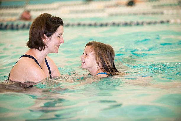 istock Smiles and Bonding during Swim Lessons 457532723