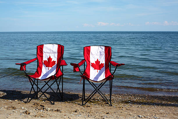 istock Chairs with Canadian flag by the lake 457549987