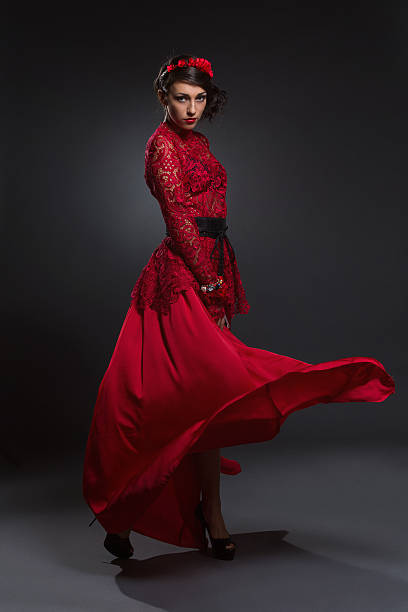 istock Girl in long red dress 457550785