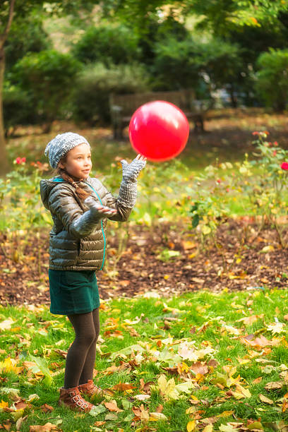 istock Little girl playing ball 457551179