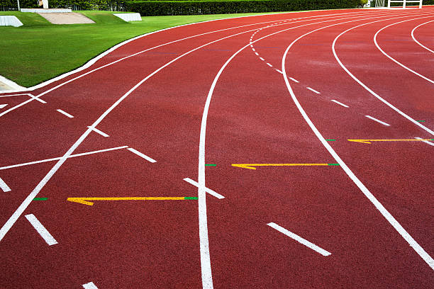 istock New running track with green grass abstract, texture, background. 457661759