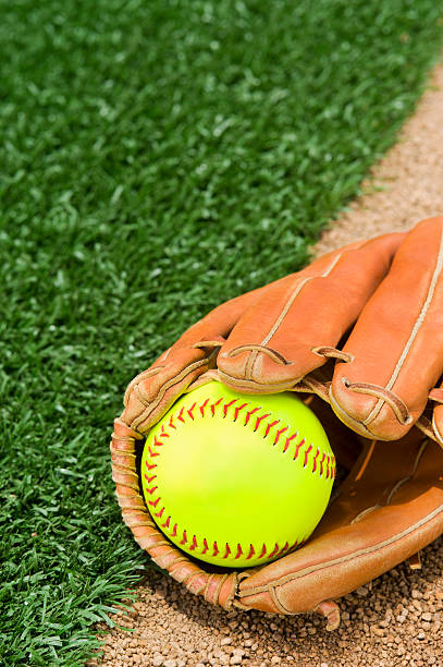 istock New Softball in glove 457671055