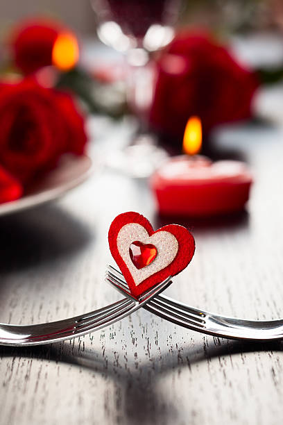 istock Two joined forks with decorative heart on Valentine's set up 457677645