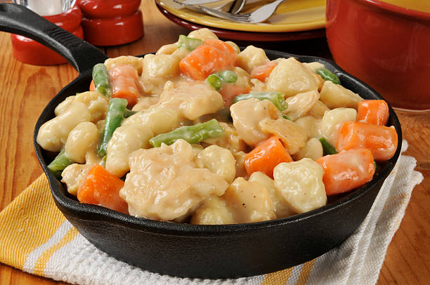 istock Chicken and dumplings in a cast iron skillet 457690979
