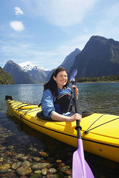 istock Woman Kayaking In Mountain Lake 457705739