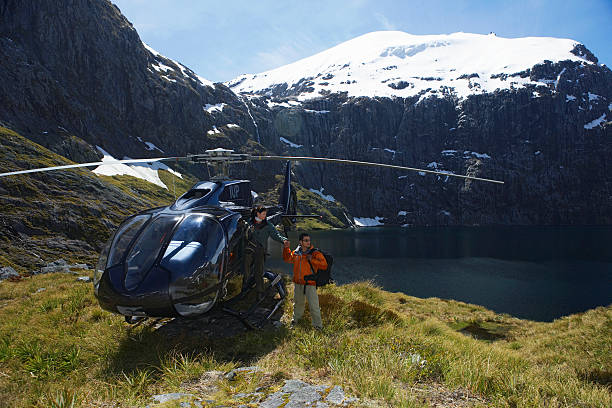 istock Hikers With Helicopter On Mountain Top 457706177
