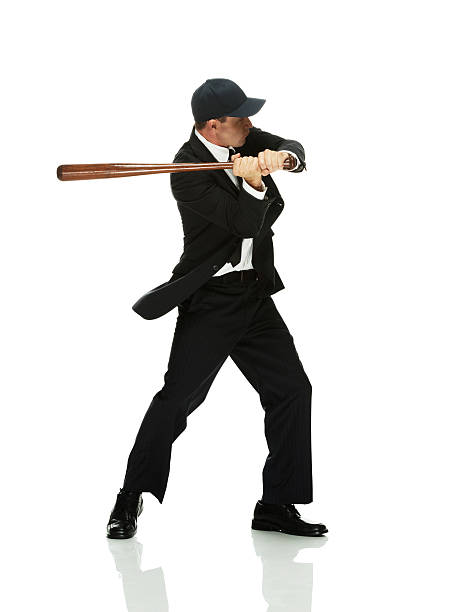 istock Businessman swinging with baseball bat 457708603