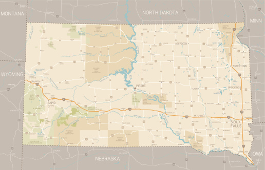 A detailed map of South Dakota state with cities, roads, major rivers, national forests, monuments, and major lakes. Includes neighboring states and surrounding water. 