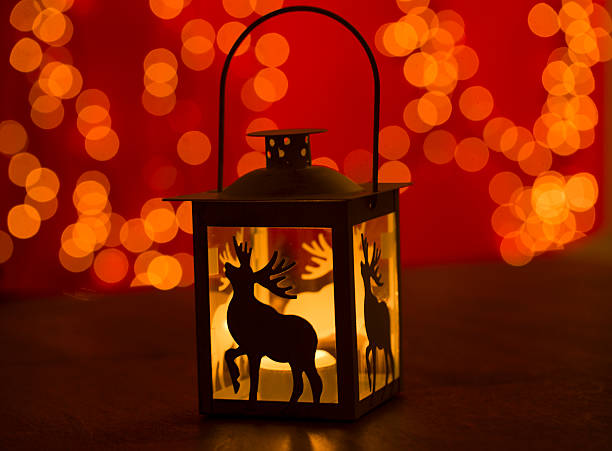 istock christmas candle lamp on wooden 457740965