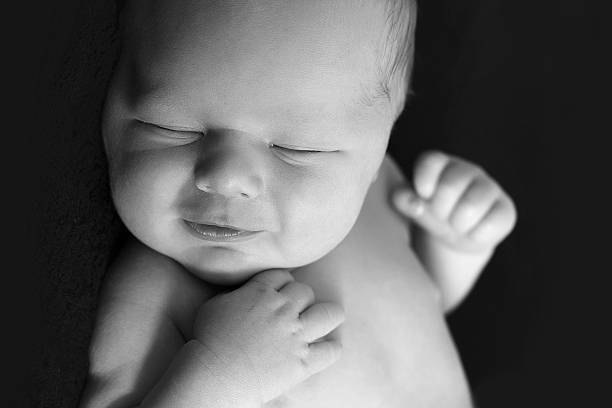 istock Newborn baby smiling 457741239