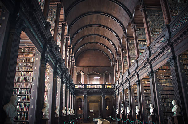 Old library Wisdom in old shelves and books trinity college library stock pictures, royalty-free photos & images