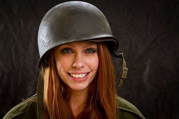 istock Cute Army Girl in Large Helmet 457745683