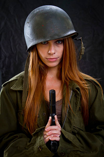 istock Army Girl with Gun Looking Forward 457745759