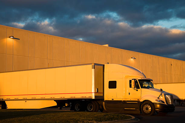 istock Semi Truck by the warehouse 457775385
