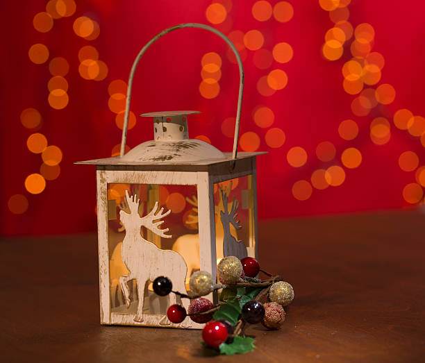 istock christmas candle lamp with decoration on wooden 457776371