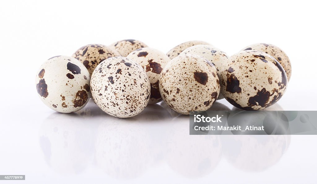 The heap of quail eggs isolated The heap of spotted quail eggs isolated Agriculture Stock Photo