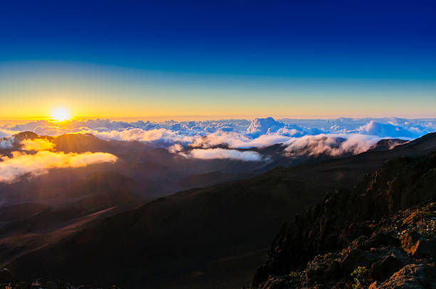 istock Clouds at sunrise over Haleakala Crater, Maui, Hawaii, USA 457779331