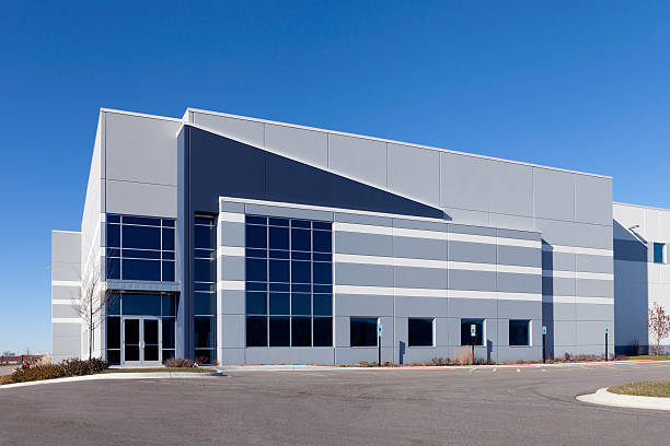 Warehouse Building Warehouse Building with a blue sky office block exterior stock pictures, royalty-free photos & images