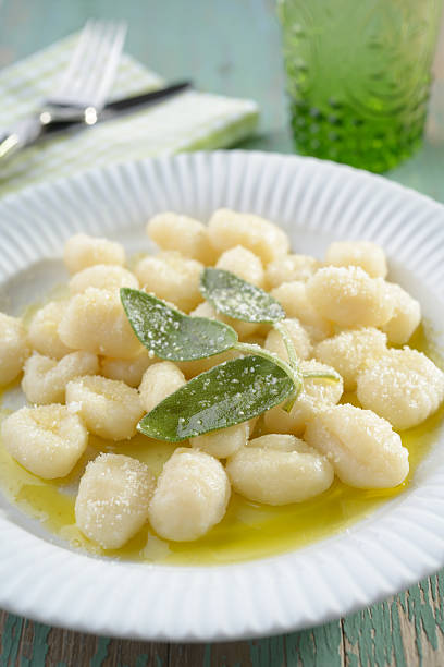 Potato gnocchi dressed with olive oil, sage, and Parmesan cheese