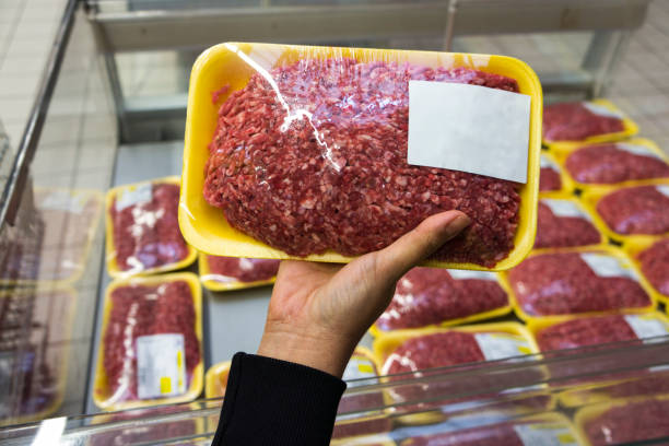 istock Hand picking meats in a supermarket 457810571