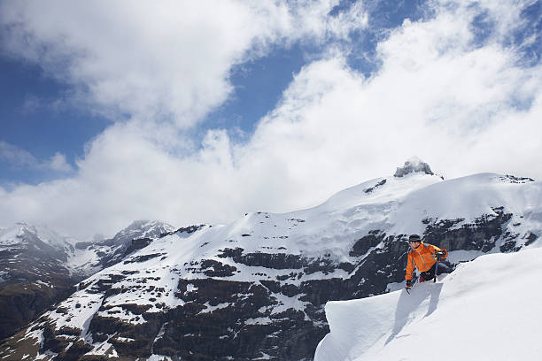 istock Mountain Climber Sitting On Snowy Peak 457811907