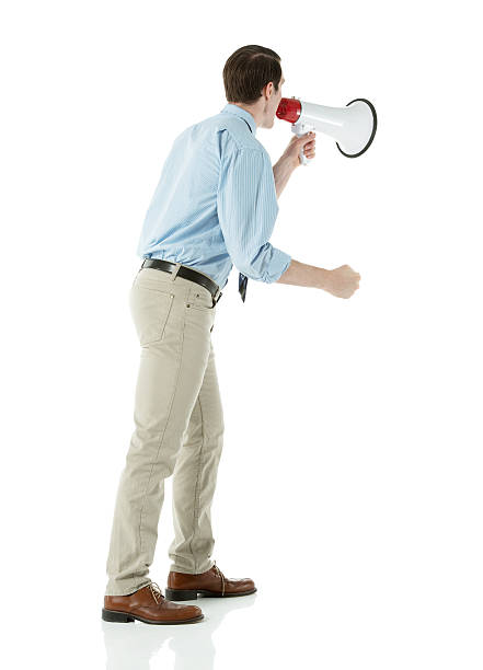 istock Businessman standing with bullhorn 457812171