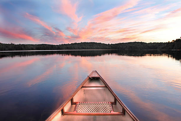 istock Canoe Bow on a Lake at Sunset 457812951