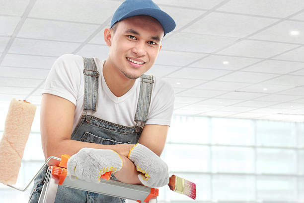 istock Young man with painting equipment 457824505