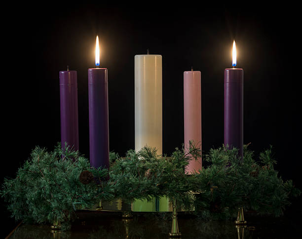 istock Long stick candles with wreath in the dark 457830441