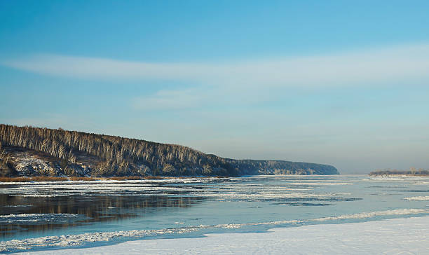 istock River freezing in beginning of winter 457838561