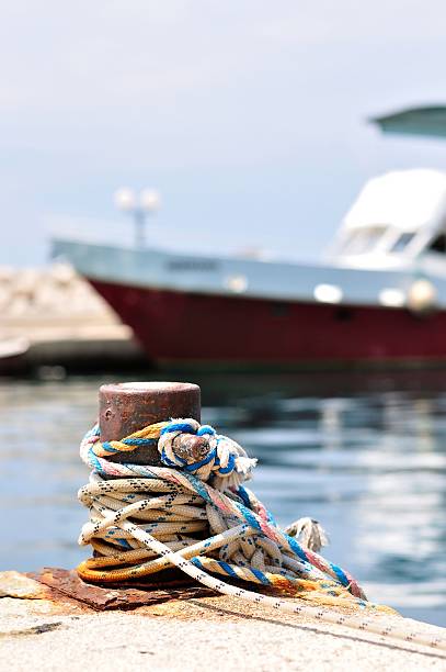 istock Marine rope on mooring bollard in port 457855187