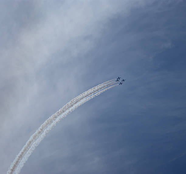 istock Flight of modern combat fighters on the sky background 457856599