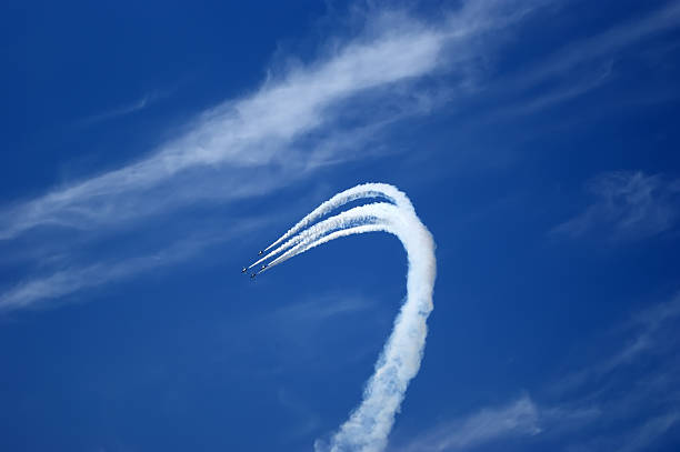 istock Flight of modern combat fighters on the sky background 457856675