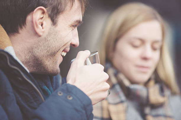 istock Smiling couple  drinking tea outdoors 457857783