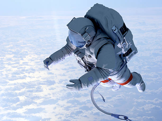 Astronaut above the clouds Astronaut in space above the clouds of the Earth. nasa kennedy space center photos stock pictures, royalty-free photos & images
