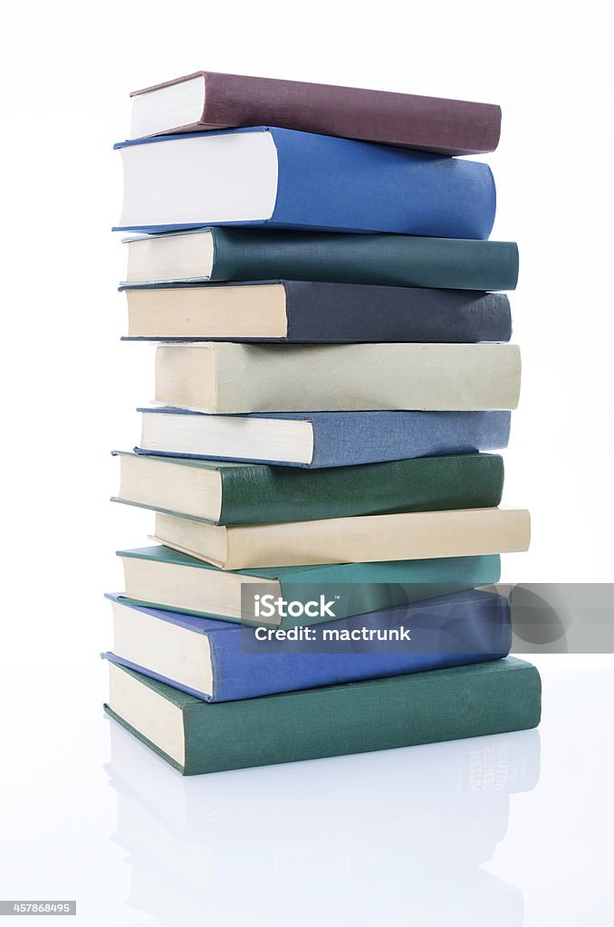 Stacked books Pile of books on white background with mirror reflection bottom. Book Stock Photo