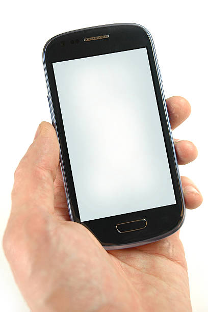 Hand holding modern smart phone stock photo