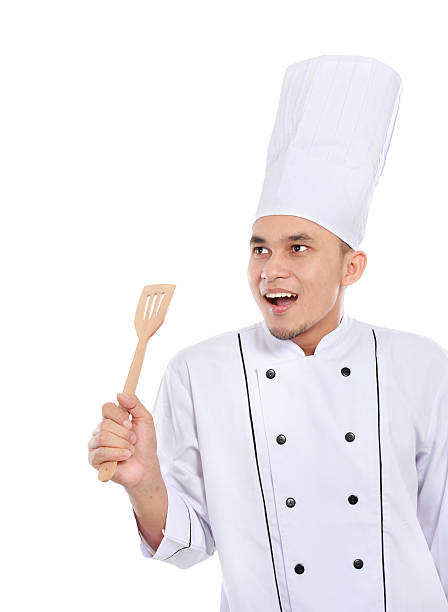 istock portrait of chef looking up copy space 457890773