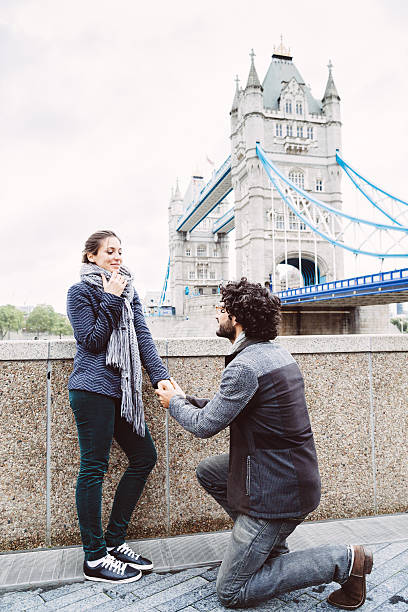 Marriage proposal in front of the Tower Bridge, London Marriage proposal in front of the Tower Bridge in a winter day, London tower bridge london england bridge europe stock pictures, royalty-free photos & images